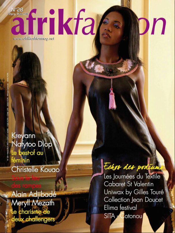"Magazine cover featuring a model in an elegant black dress with pink floral accents, reflecting African fashion themes."